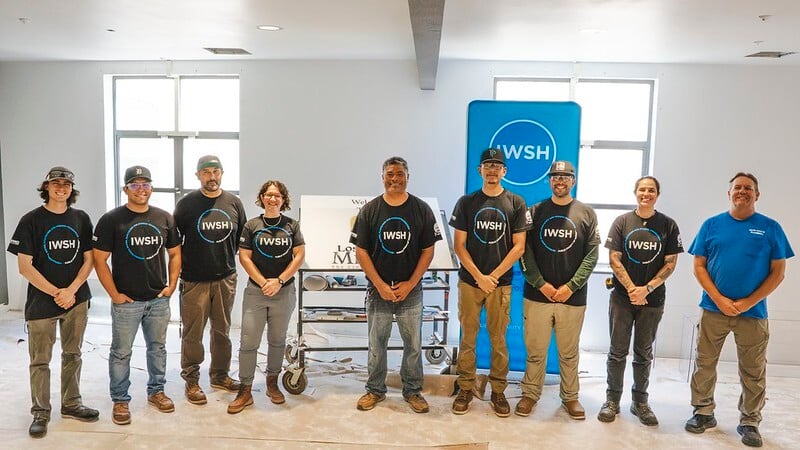 Plumbers lined up with IWSH logo