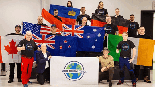 IWSH Plumbing Champions holding flags