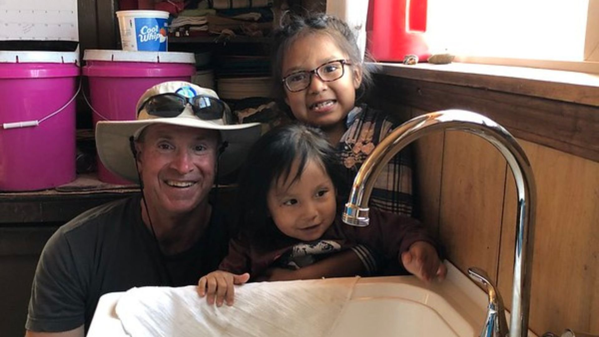 IWSH Plumber with kids and sink Navajo Nation