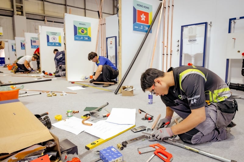 Plumbers competing at the WPC2026 skills competition
