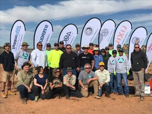 IWSH volunteers with sponsor banners on the Navajo Nation